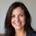 Professional headshot of Elara Vance, smiling warmly.